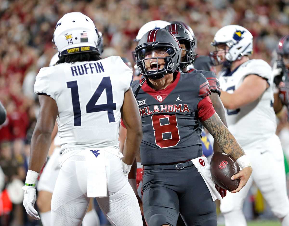 Oklahoma Sooners quarterback Dillon Gabriel reacts after scoring a touchdown against the West Virginia Mountaineers.